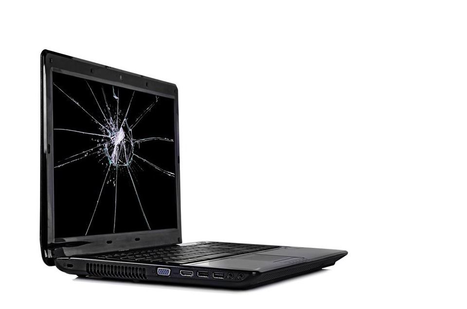 black laptop with a broken screen