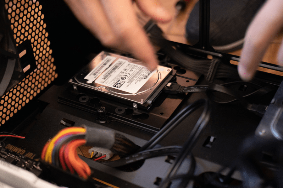 close up hard disk drive inside a computer case