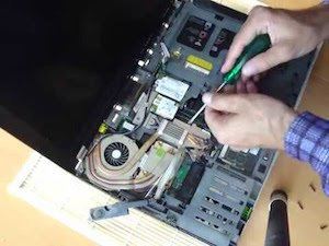 professional laptop repairer while repairing the laptop